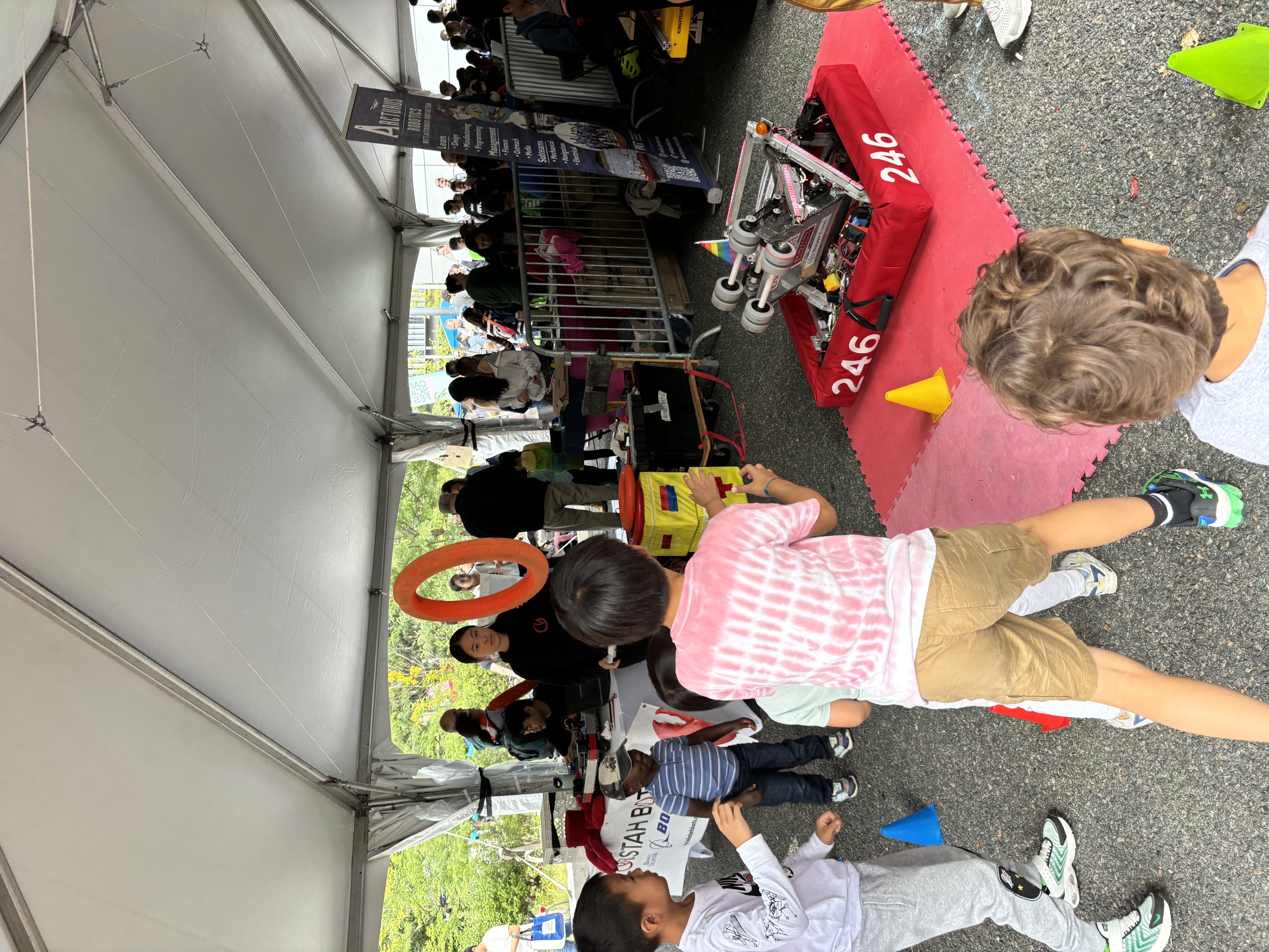 Kids play catch with our robot at the Cambridge Science Festival Carnival